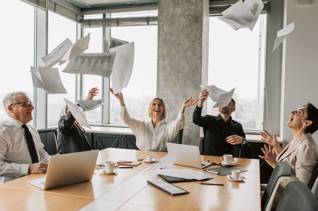 Company celebrating over getting rid of excessive documentation.