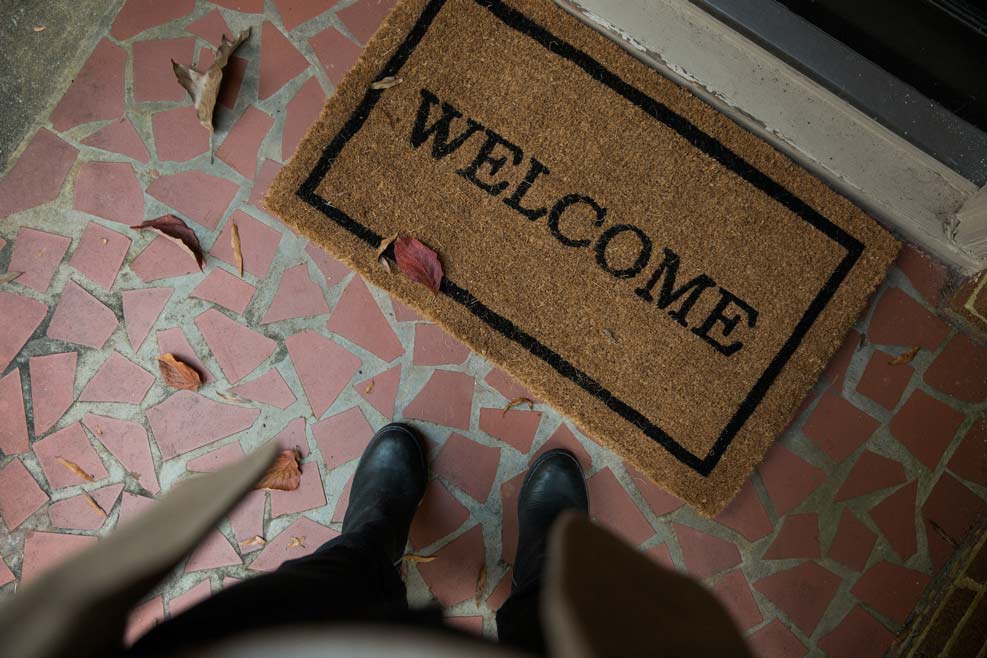 Welcome mat at a front door.